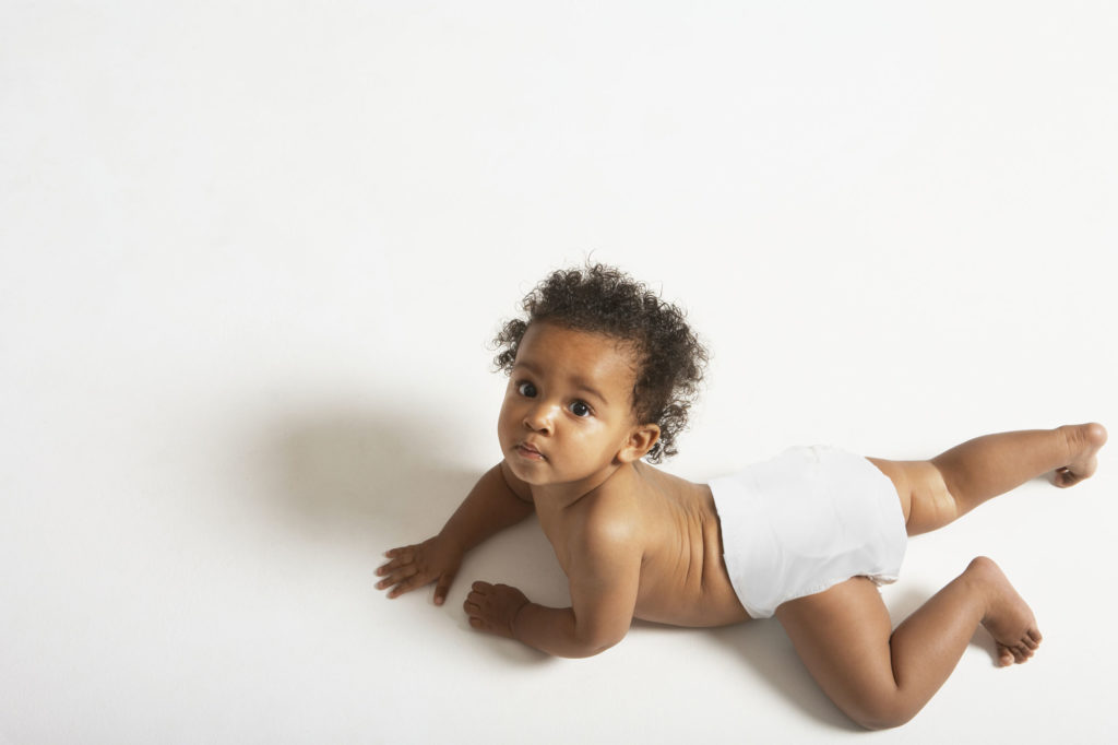 baby in white diaper