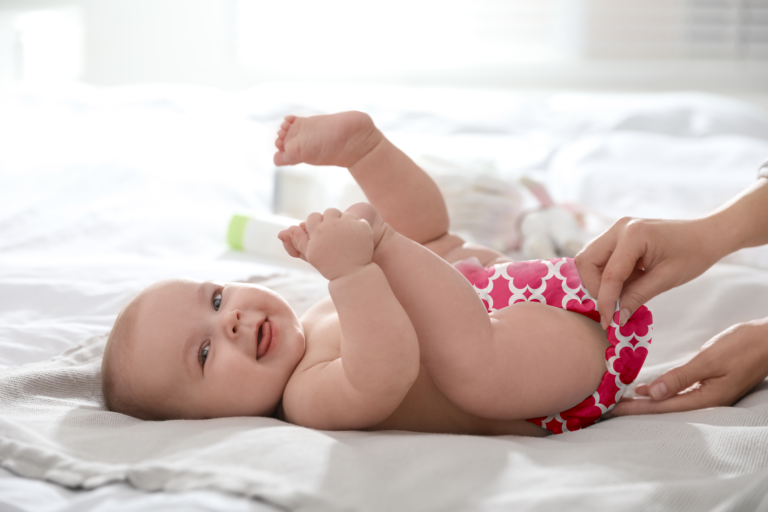 baby wearing fuchsia diaper